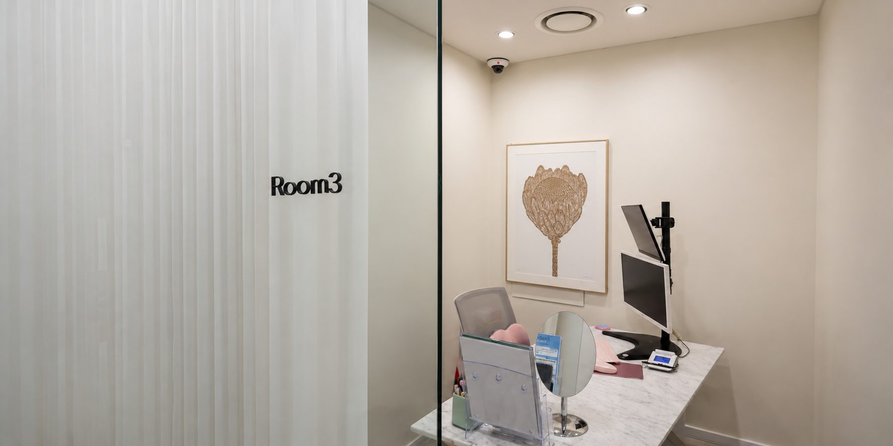 Consultation room with a desk and monitors at Dr. E-Laser Dermatology in Seoul